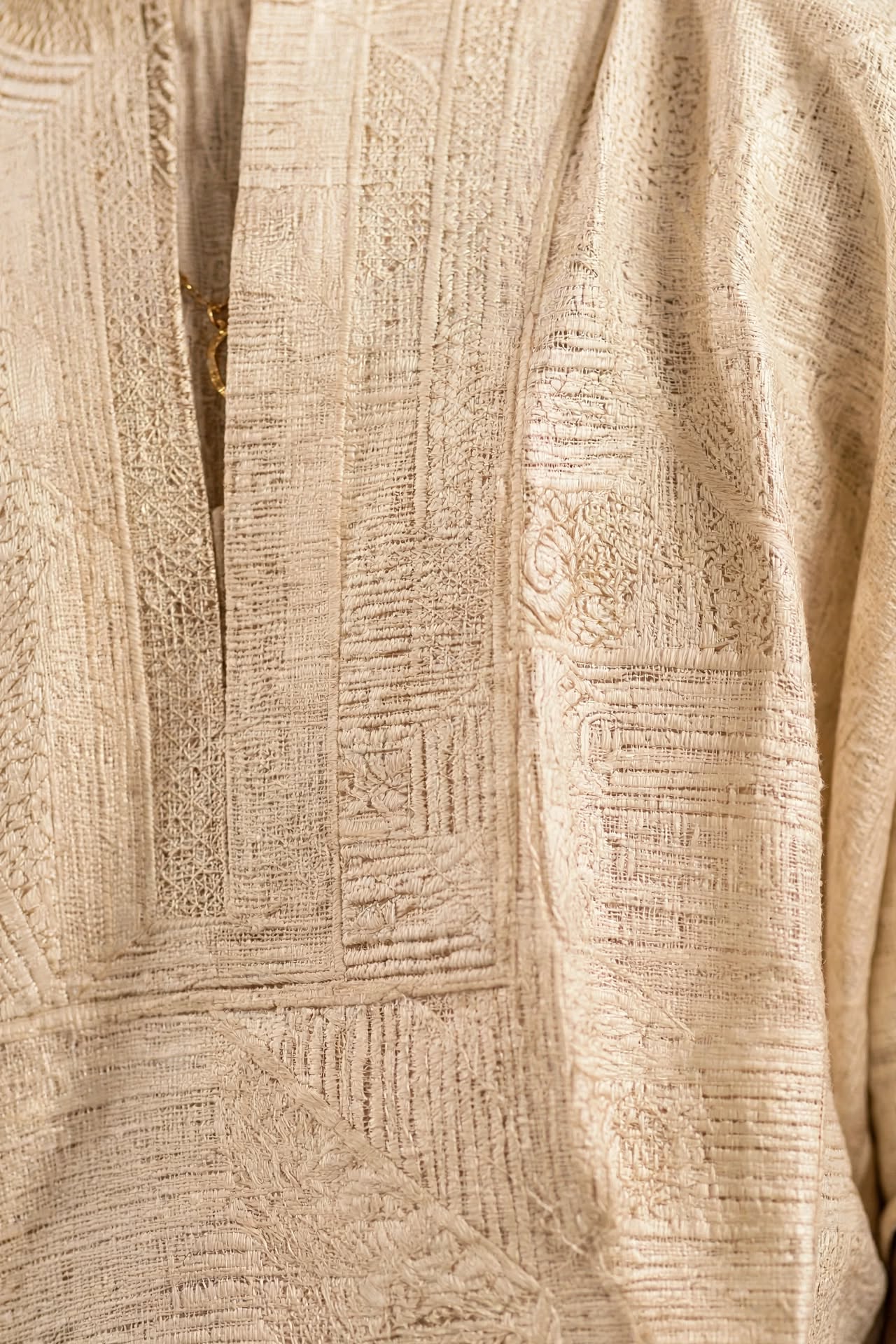 AI detail photography: macro of embroidered fabric texture